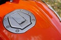 Orange colored Bike gas tank close up view