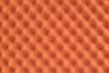 Orange colored egg crate foam sheet packing material background. Royalty Free Stock Photo