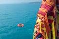 The orange-colored lifebuoy is thrown into the blue sea against the background of the life-rescue Royalty Free Stock Photo