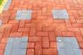 Orange colored paving block bricks path in the park Royalty Free Stock Photo