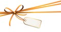 orange colored ribbon bow with hang tag Royalty Free Stock Photo