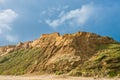 Orange coloured sand dunes and beach at Bayleys beach in Northland