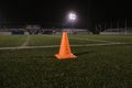 Orange cone for training football on the field Royalty Free Stock Photo