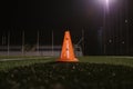 Orange cone for training football on the field Royalty Free Stock Photo