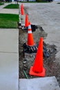 Orange cones along street ready for roadwork Royalty Free Stock Photo