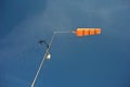 Orange conical windsock and wind cone