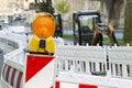 Orange construction Street barrier light on barricade. Road cons