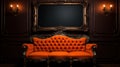 an orange couch with a frame displayed on an ornate wall Royalty Free Stock Photo