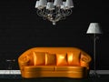 Orange couch, table, chandelier and standard lamp