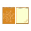 Orange cover notebook with round ornate star Royalty Free Stock Photo