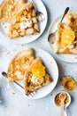 Orange and cream with nuts crepes with honey