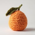 Orange Crochet Fruit With Green Leaf on White Studio Background Realistic Craftsmanship Royalty Free Stock Photo