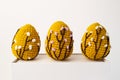 Orange crocheted Easter eggs on a white background. Easter Eggs