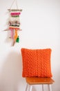 Orange crocheted pillow
