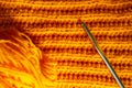 Orange crocheted texture and hook