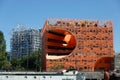 Orange cube, a modern office building in the business district in a sunny weather