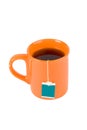 Orange cup with tea bag Royalty Free Stock Photo