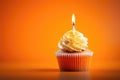 Orange Cupcake With Lighted Candle On Orange Background, Empty Space. Generative AI