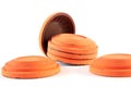 Orange cymbals for trap shooting on white background