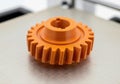 Of orange 3d printed gear on, showcasing manufacturing Royalty Free Stock Photo