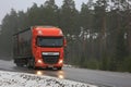 Orange DAF XF Semi on Wet Road