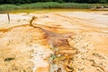 Orange dangerous  water  bed on abandoned kaolin quarry Royalty Free Stock Photo