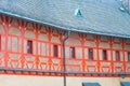 Orange decorated facade of medieval castle Karlstejn in Czech Re