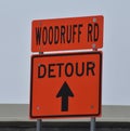 An orange detour sign on an interstate highway