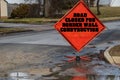 Orange diamond shaped Road Closed for border wall construction sign blocking a street Royalty Free Stock Photo