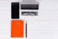 Orange diary with a pen, glasses and open case for glasses near Royalty Free Stock Photo