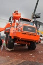 Orange diesel excavator and lorry