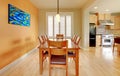 Orange dining room with hardwood