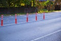 Orange dividing posts on the road. Selective focus