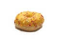 Orange donut decorated with colorful sprinkles