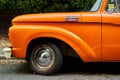 Ramsgate, United Kingdom - June 29, 2021: Front wheel arch of a mid sixties orange Ford F100 Pickup Truck