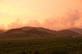 Orange dramatic sunset over hills Royalty Free Stock Photo