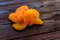 Orange dried apricot on a dark wooden table textural Royalty Free Stock Photo