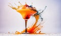 an orange drink splashing into a glass on a white background Royalty Free Stock Photo