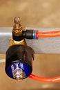 orange duct tubes of pneumatic system connected to pneumatic regulator Royalty Free Stock Photo