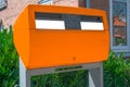 Orange Dutch letterbox to post letter