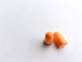 Orange ear plugs alignment  on white background Royalty Free Stock Photo