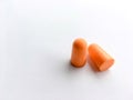 Orange ear plugs alignment  on white background Royalty Free Stock Photo