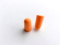 Orange ear plugs alignment on white background Royalty Free Stock Photo