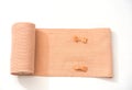 Orange elastic bandage roll and on white background Royalty Free Stock Photo