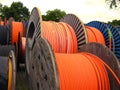 Orange electricity cable on wooden spools Royalty Free Stock Photo