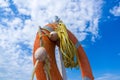 Orange emergency lifebuoy on a pebbly sea beach, close up Royalty Free Stock Photo