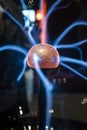 Orange energy sphere ball with blue plasma lightning rays