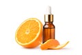 Orange essential oil in amber dropper bottle