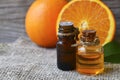 Orange essential oil in a glass bottles for skin care, spa, wellness, massage, aromatherapy and natural medicine. Royalty Free Stock Photo