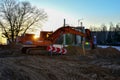 Orange excavator at a construction site